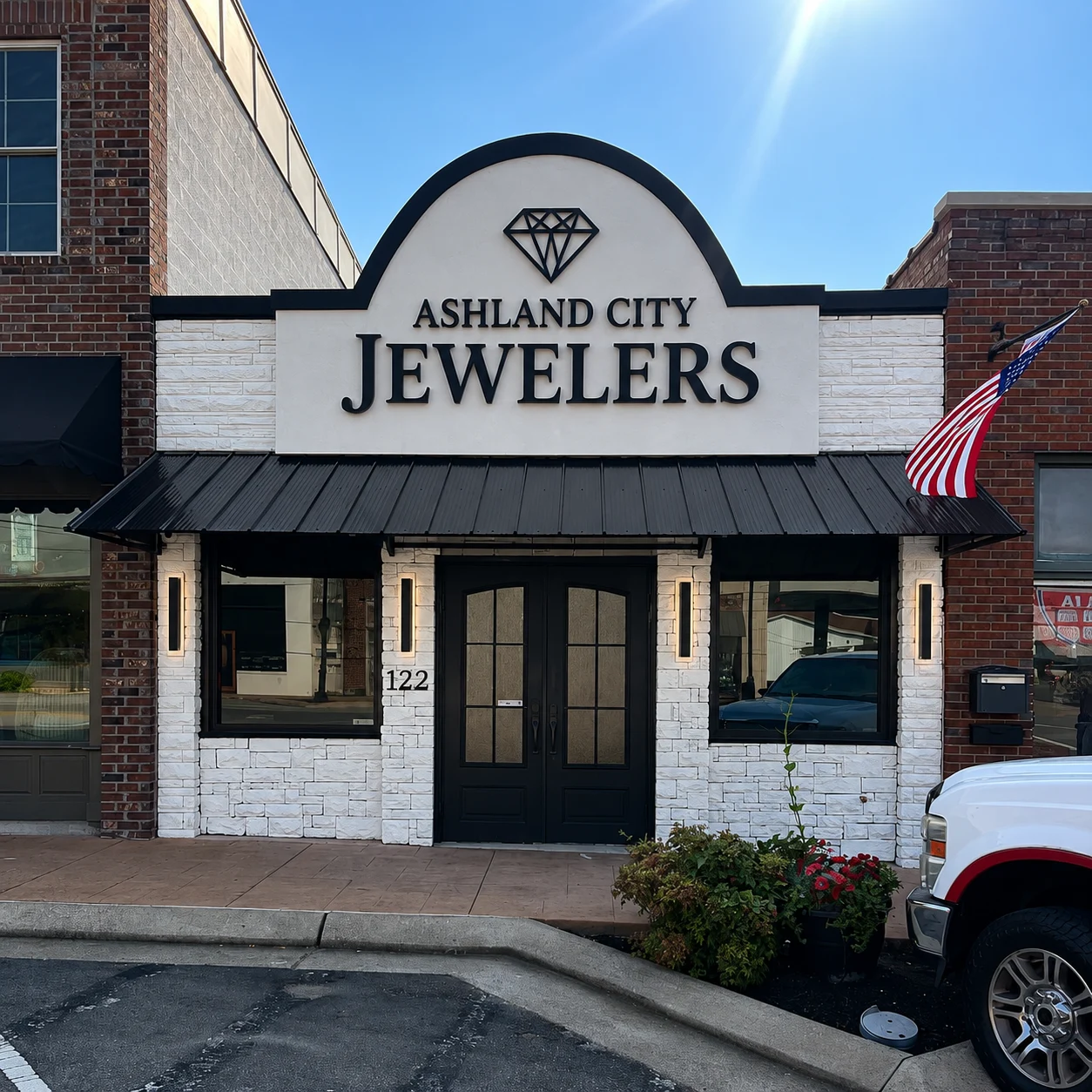 Ashland City Jewelers storefront on Main Street, with white brick and black awnings